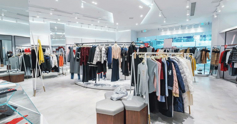Women's clothing hung on racks in department store